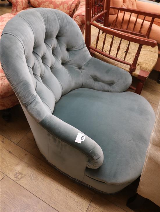 An upholstered bucket chair